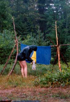 On the last moring, we awoke to rain. Boo. Whats more, the critters had finally got to our food bag which we'd carefully hung away from the tent. Rachel checks the damage, and wonders if we should have brought the towels in earlier.